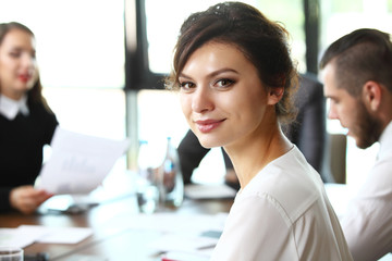 business woman with her staff, people group in background 