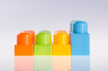 Plastic building blocks on background
