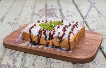 Toast cream is placed on a wooden table