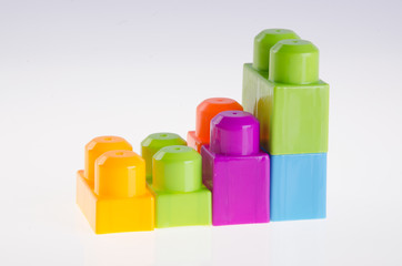 Plastic building blocks on background