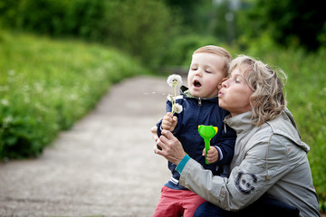 boy and woman with dandelion