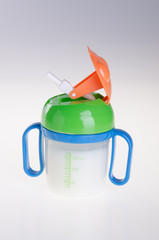 Obraz premium Baby bottle with milk on background