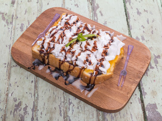 Toast cream is placed on a wooden table