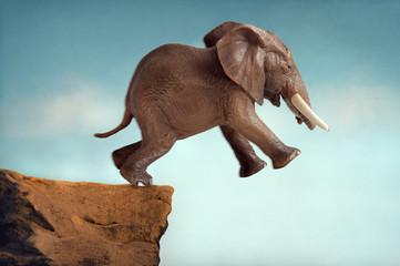 Naklejka na ściany i meble leap of faith concept elephant jumping into a void