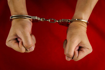 Hand of a man with handcuff