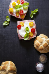 italian sandwich with ham, Multicolored cherry tomatoes, basil.