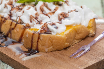 Toast cream is placed on a wooden table