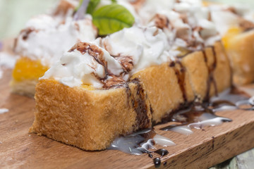 Toast cream is placed on a wooden table