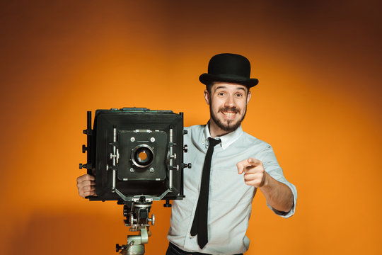 young man with retro camera 