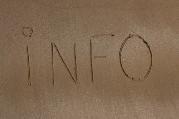 Write the word info on the sand
