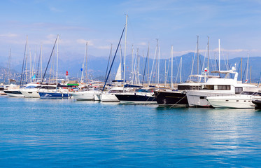 Fototapeta premium Sailing yachts and motorboats in marina