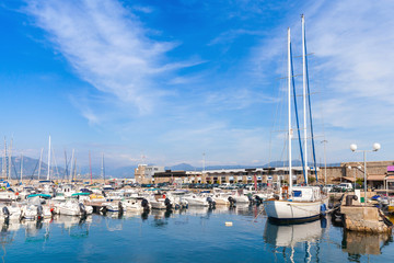 Fototapeta na wymiar Sailing yachts and pleasure motor boats in marina