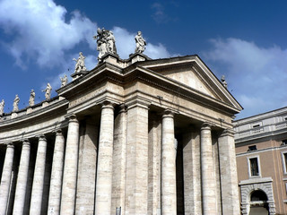 Fototapeta na wymiar Building with columns and statues in Vatican, Rome, Italy