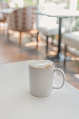 white coffee cup in coffee shop