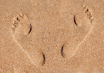 Two footprints in the sand