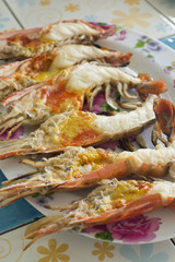 Grilled giant river prawn on dish.
