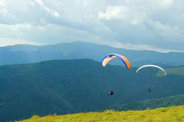 paragliding over mountains