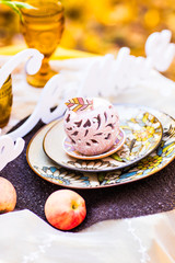 Decorated table for a  dinner in autumn Park.