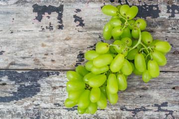 green grapes with wooden background