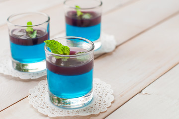 blue hawaiian with blueberry panna cotta dessert on white wooden