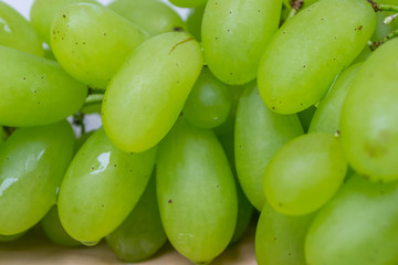 green grapes with wooden background