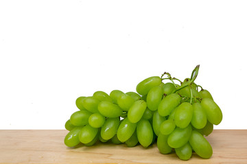green grapes with wooden background