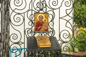 Fototapeta na wymiar Pskov, Russia. The icon and the Psalms in the chapel at the Theological cemetery