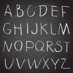 Obraz premium Chalk hand drawing alphabet on a blackboard
