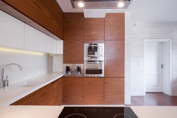 Spacious white and brown kitchen