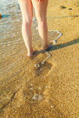 footprints in the sand on the beach
