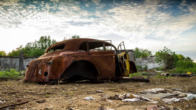 Old retro car at the junkyard
