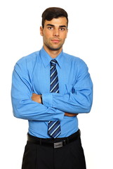 Portrait of young standing businessman in blue shirt and tie