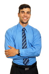 Portrait of young smiling businessman in blue shirt on white background