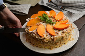Peach slices and mint leaves on a pie