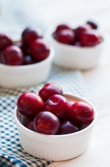 Sweet plums on wooden background