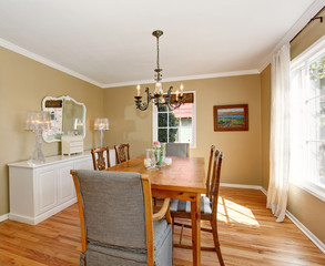 Classic dinning room with white cabinets.