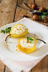Delicious dessert with pears, sliced halves and curd cream on a