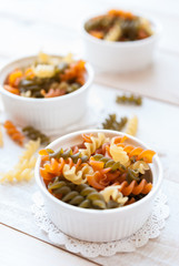 Italian Penne Rigate Macaroni Pasta raw in ramekin bowl
