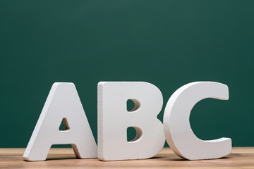 abc letters in front of board - 88506962