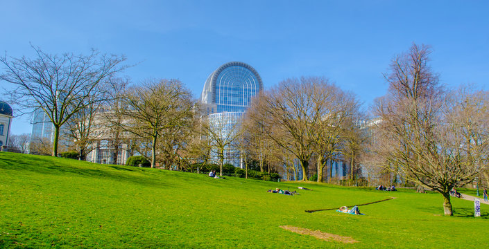 Building of the european parliament is one of the most spectacular buildings in brussels and adjacent park is popular place to relax.