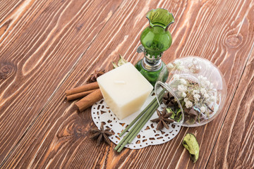 spa stuff on wooden background: candle, aroma