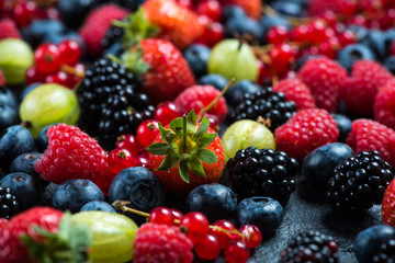 Mixed fresh ripe berries background