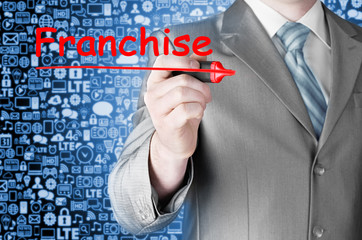 business man writing franchise