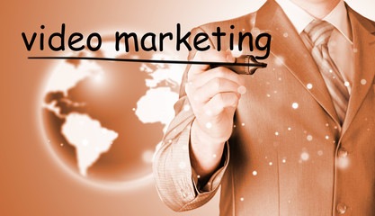 business man writing Video Marketing