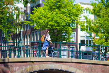 Young beautiful woman walking in european city, Amsterdam