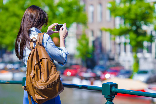 Young Woman Tourist Taking Photo On Beautiful View Of European