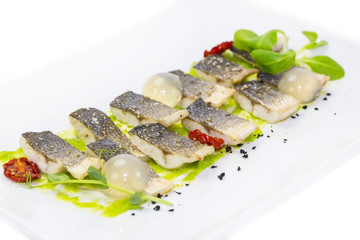 baked black cod fish on a white background in the restaurant