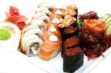 serving traditional Japanese sushi on white background