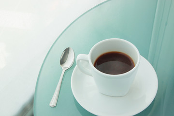 cup of coffee on a mirror table