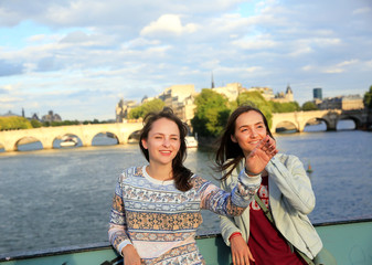 Happy beautiful student girls in Paris